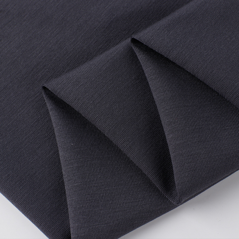 Textura en primer plano de tela de jersey de spandex de algodón con acabado en amoníaco líquido 50S